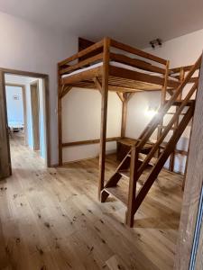 a room with a bunk bed in a house at Residence Spillenberg Apartment 1A in Levoča