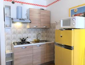 A kitchen or kitchenette at Beautiful Apartment with Sea View - Including Beach Place by Beahost Rentals