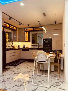 a kitchen with a table and chairs in it at 2 bedrooms Smart Home 5m drive to the Sea in Nabeul