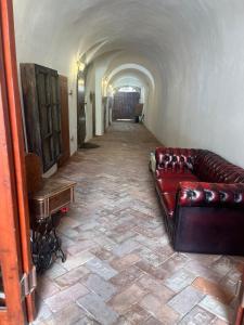 a long hallway with a couch and a table at Spillenberg House Main Property 2024 in Levoča