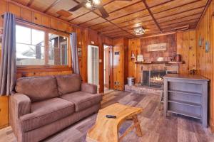 a living room with a couch and a fireplace at Little Pines Couples Lakeside Cabin by Big Bear Vacations in Big Bear Lake