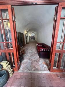 a long hallway with a couch in a room at Residence Spillenberg Apartment 1B in Levoča