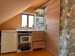 Kuchyň nebo kuchyňský kout v ubytování LOFT Natalya Gold