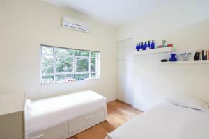 Säng eller sängar i ett rum på Blue Quartz by HolyGuest