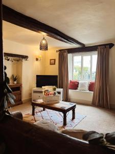 Posezení v ubytování Holly Cottage