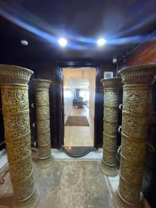 a hallway with pillars and a hallway with a hallwayngthngthngthngthngthngth at gleem alexandria in Alexandria