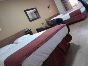 Postel nebo postele na pokoji v ubytování Travellers Motel