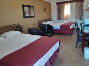 Postel nebo postele na pokoji v ubytování Travellers Motel