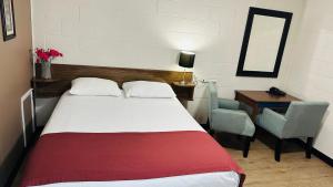 Postel nebo postele na pokoji v ubytování Travellers Motel
