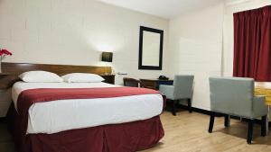 Postel nebo postele na pokoji v ubytování Travellers Motel