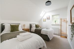 En eller flere senge i et værelse på Charming Cotswold Cottage Stow-on-the-Wold, Dog Friendly