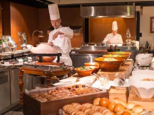 a kitchen filled with lots of different kinds of food at Hotel Nikko Osaka in Osaka