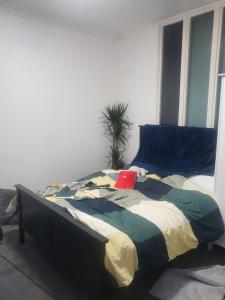a bed in a room with a red box on it at Queensgate centre in Stifford +3 photos