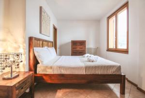 Posteľ alebo postele v izbe v ubytovaní Villa Serena