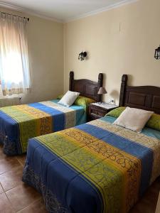 Säng eller sängar i ett rum på Casas Rurales Cerro Lobo