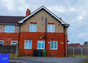 a red brick house with two trash cans in front of it at 2ndHomeStays-Dudley-Suitable for Contractors and Families, Parking available for 3 Vans, Sleeps 12 in Dudley