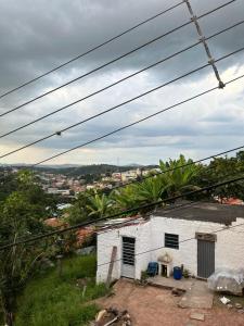 a white house with a view of a city at Hospedagem Zefino in Cunha