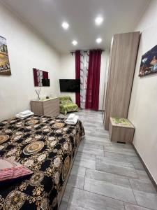 a hotel room with a bed and a living room at Mary House Apartments in Catania