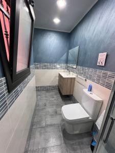 a bathroom with a toilet and a sink at Mary House Apartments in Catania