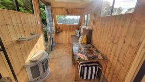 an inside view of a tiny house with a bench at Trailor Escape in Birchington