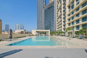 a swimming pool in the middle of a building at Burj Royale 2 Bed with Burj Khalifa View in Dubai