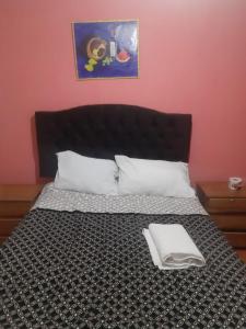 Rúm í herbergi á Hostal Ayllu