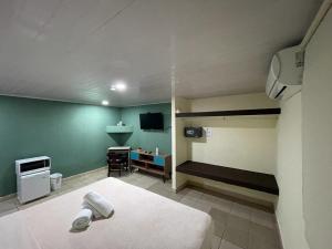 Voodi või voodid majutusasutuse Hostal EL Prado toas