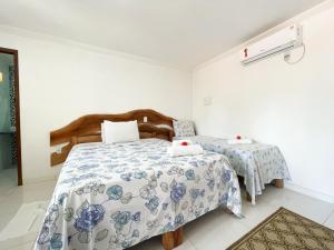 Giường trong phòng chung tại Pousada Lua Cheia
