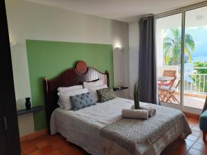 Cama ou camas em um quarto em ti punch vue sur mer