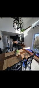 a living room with a table with a pair of scissors at L'hêtre au Sommet (gîte) in Sainte Anne des Lacs