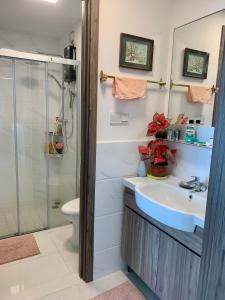 a bathroom with a sink and a shower at Colorful Seaview apartment Forestcity Johor Bahru Malaysia in Gelang Patah