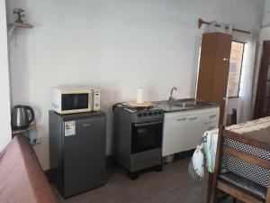 Dapur atau dapur kecil di Casa acogedora y funcional
