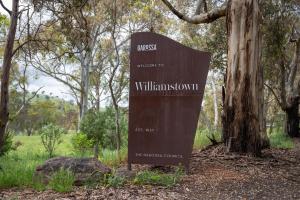 a sign for the wilderness center in a forest at Barossa Garden Homestay in Williamstown