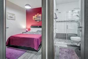 a bedroom with a bed and a shower at Apartment Slavica-New-With Jacuzzi in Split