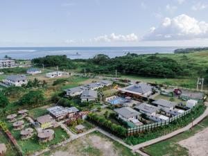 an aerial view of a house with the ocean in the background at Seatiki Resort Fiji On Coast in Sigatoka