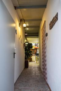 a corridor of a building with a hallway at Filuvespri in Comiso