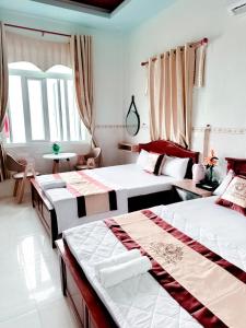 Tempat tidur dalam kamar di Khách Sạn Tuyết Linh Lý Sơn