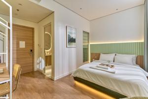 Postel nebo postele na pokoji v ubytování Adela Hotel Dalat