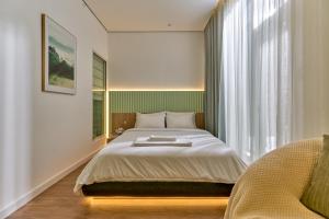 Postel nebo postele na pokoji v ubytování Adela Hotel Dalat