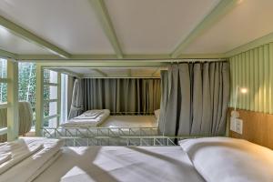 Postel nebo postele na pokoji v ubytování Adela Hotel Dalat