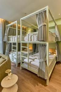 Postel nebo postele na pokoji v ubytování Adela Hotel Dalat