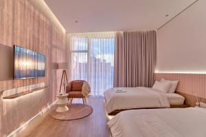 Postel nebo postele na pokoji v ubytování Adela Hotel Dalat