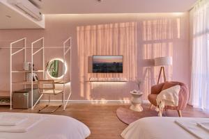 Postel nebo postele na pokoji v ubytování Adela Hotel Dalat