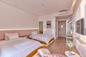 Postel nebo postele na pokoji v ubytování Adela Hotel Dalat