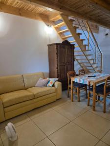 a living room with a couch and a table at Siedlisko U Ani in Skrzynki