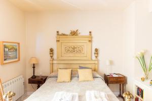 a bedroom with a large bed and two night stands at Cozy Mallorca! in Palma de Mallorca +23 photos