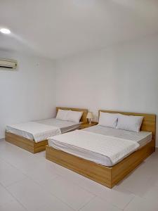 Postel nebo postele na pokoji v ubytování Maria Hotel