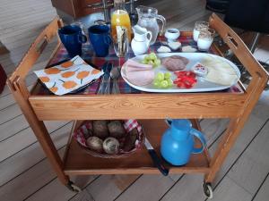 a table with a plate of food on it at Villa Wolte Bed and Breakfast in Ringsted