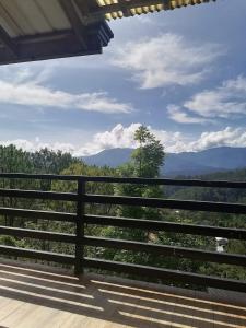 a balcony with a view of the mountains at Mavy's Maligcong Homestay in Bontoc