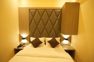 Postel nebo postele na pokoji v ubytování HOTEL BOSTON